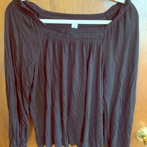 Long sleeved black top.